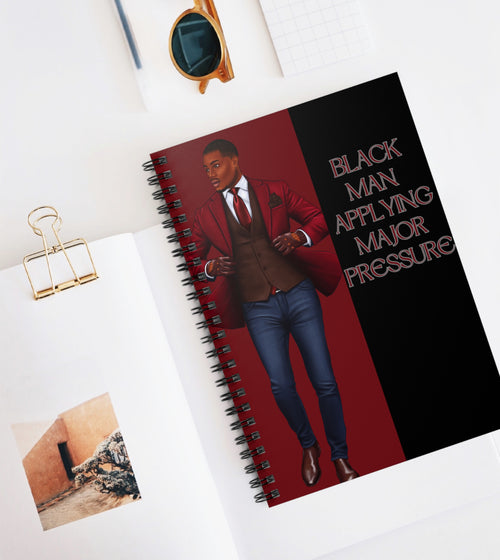 BLACK MAN APPLYING PRESSURE NOTEBOOK