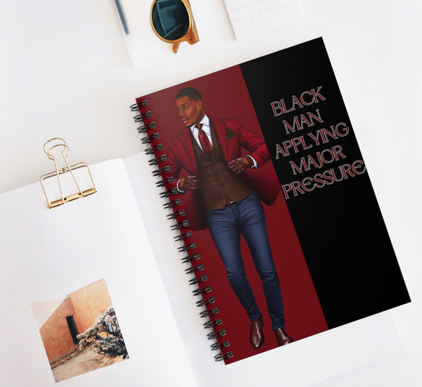 BLACK MAN APPLYING PRESSURE NOTEBOOK